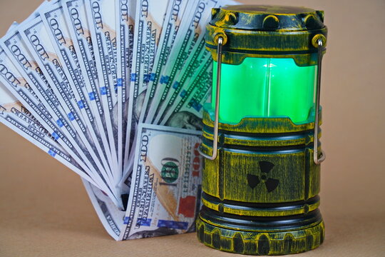 A nuclear reactor. A lamp-figurine with a symbol of radioactivity and dollars.
