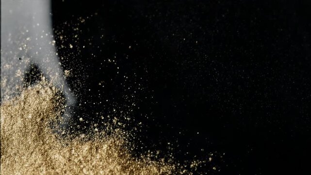 漆黒と金粉がゆっくり混ざり合う俯瞰背景動画