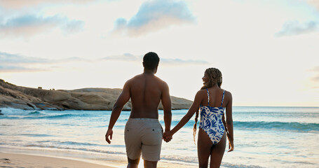 Obraz premium Couple, holding hands and laughing on beach holiday, relax and together on summer adventure or date. Back, black people and affection for partner at sea, love and outdoor for anniversary and romance