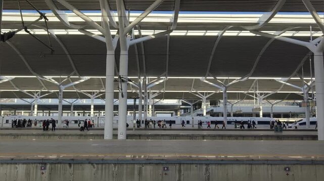 Chinese high speed train departing from platform.