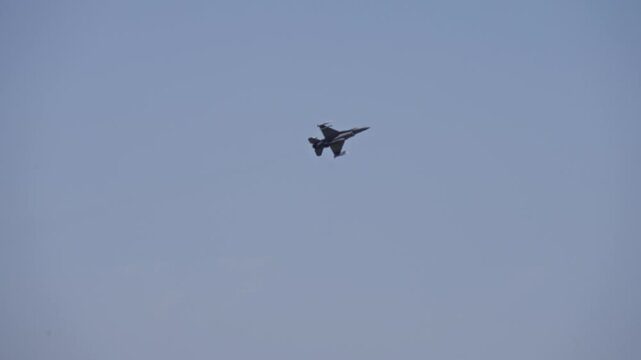 F-16 Fighter Jet Flyover Above Military Air Base with Close-Up Tracking Turn