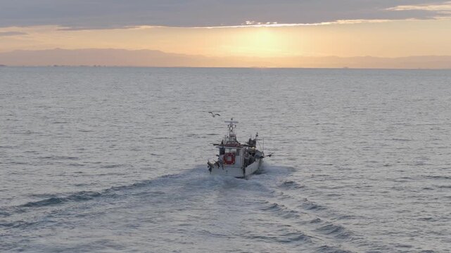 Europe Italy Coast - chasing a Fisher boat on a beatiful sunrise morning 6K -