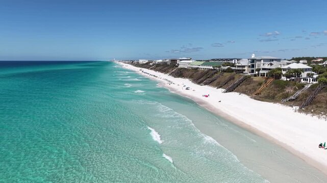 Aerial coastline view of white Alys Beach with emerald ocean water and seaside houses, Panama City, Florida, USA