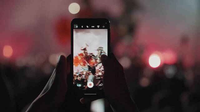 Ogoh Ogoh festival in Bali captured on smartphone by crowd at night, people recording traditional parade and ritual