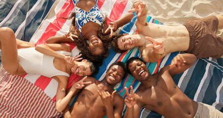 Portrait, beach and friends with peace sign for selfie, social media post and picture for summer break. Rock gesture, above or happy people with photography for holiday memory, travel vacation or pov © peopleimages.com