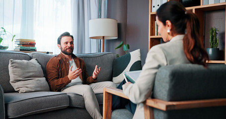 Fototapeta premium Happy man, patient and talking with therapist for counseling, rehabilitation or therapy session. Male person, client and speaking with counselor or psychologist for mental health or advice in office