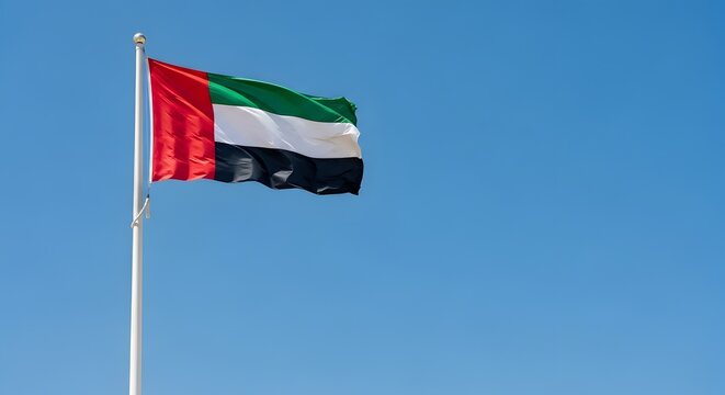 The united arab emirates flag waving high on a clear day