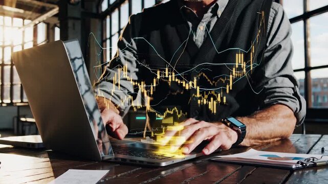 laptop on desk with keyboard and hand typing. chart and graph overlay on screen. stock and trading data merge with finance analysis. market activity captured at workstation. market data overlay.