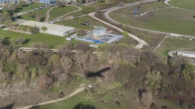 Aerial cockpit view of the shadow of a jet airplane on the ground approaching to the runway. Captured from a medium size jet cockpit. daylight, sunny.