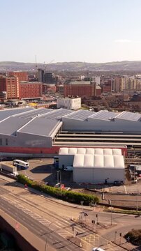 Low advancing 60FPS aerial GV of Grand Central Station in Belfast, Northern Ireland in the UK. Produced in 1080x1920 with Rec709 color.