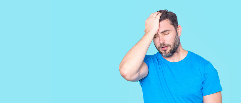 Man with Migraine headache. Tension or cluster headache, migraine close up male portrait. Head pain concept. Headache and migraine. Migraine symptoms. Chronic headaches. Headache triggers.