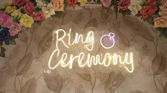 Neon Ring Ceremony Sign with Floral Arch Backdrop for Engagement Party Decoration and Romantic Celebration Event Decor