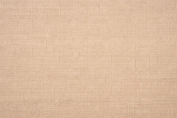 Fototapeta premium Seamless light brown canvas fabric texture with fine cotton weave and soft natural variation. Evenly lit clean surface with warm neutral tones, minimalistic background, ultra detailed and perfect for 