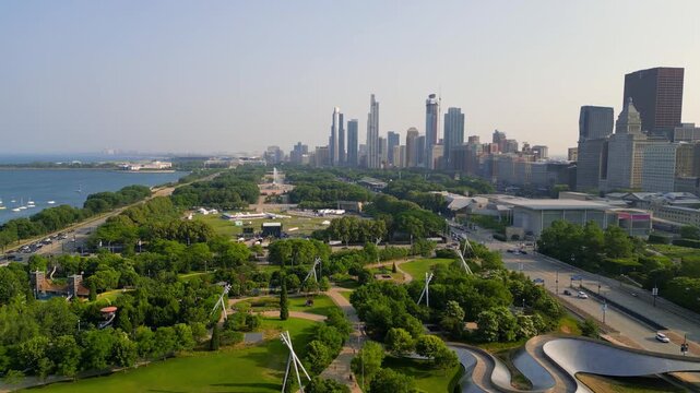 Aerial flight over Maggie Daley Park towards Chicago skyline