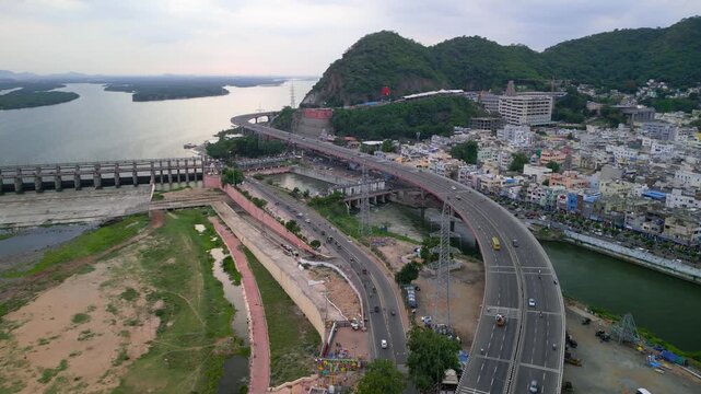 Aerial shot revealing the Prakasam Barrage and Kanaka Durga Varadhi flyover on the Krishna River