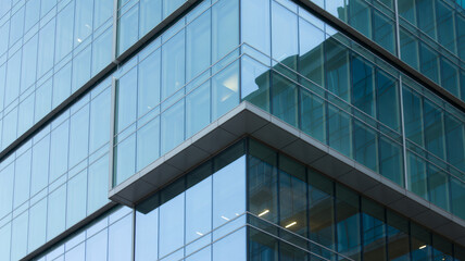 Obraz premium Aerial view of a modern glass office building architecture.