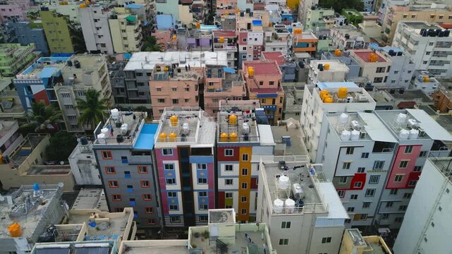 Drone flying over a dense urban indian neighborhood in Bengaluru, India.