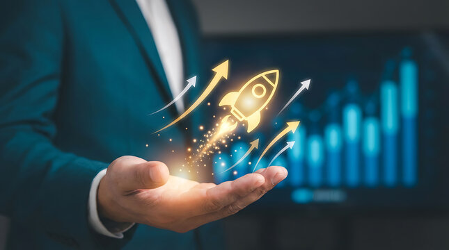 A man in a business suit holds his hand out with a glowing rocket ship and arrows rising from it in front of a blurred bar graph background