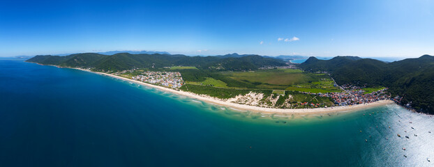 Aerial panorama of the Brazilian coast. South of the island of Santa Catarina with the views of the beaches of Acores and Pantano do Sul. Florianopolis, Brazil
