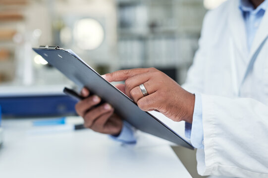 Scientist, hands and review clipboard in lab for clinical trial diagnostics, progress report and innovation. Science, person and checklist at work for research results, medical findings or experiment