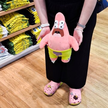 Editorial Photo of Patrick Star SpongeBob SquarePants Plush Toy 50th Anniversary Collection Held in Front of Uniqlo Store Background on January 30, 2025 in Bangkok, Thailand