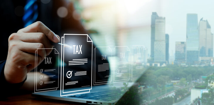Business professional managing digital tax documents on virtual interface over city background illustrating financial technology, online accounting compliance modern corporate data management concept.