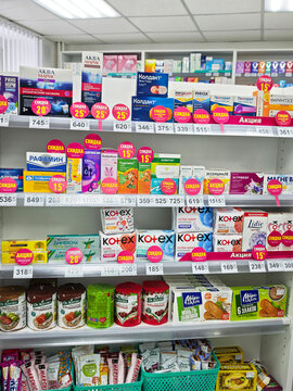 Kirov, Russia - February 14, 2026: Pharmacy shelf displaying various health products during business hours in a retail space
