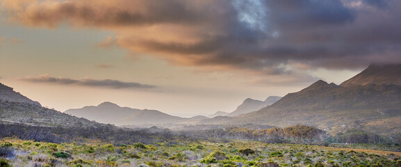 Naklejka premium Sky, mountain and landscape with storm in nature for environment, destination and journey. Ecosystem, sustainability and ecology with winter weather in countryside for path, background and outdoor
