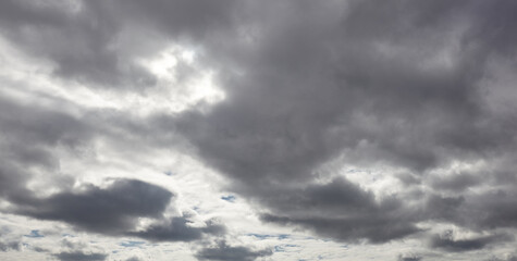 Fototapeta premium Panoramic photo of Dramatic dark clouds before rainy. Beautiful cloudscape over horizon, sky