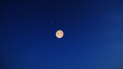 Lunar eclipse on a starry Milky Way background. © astrosystem