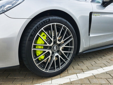 Stuttgart, Germany, November 17, 2025: A Porsche wheel with Michelin tires on a Porsche E-Hybrid, close-up, selective focus.
