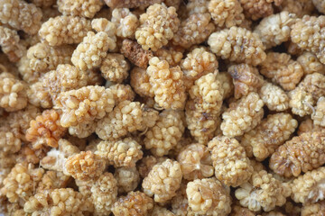 Close up photo of dried white mulberry, selective focus.