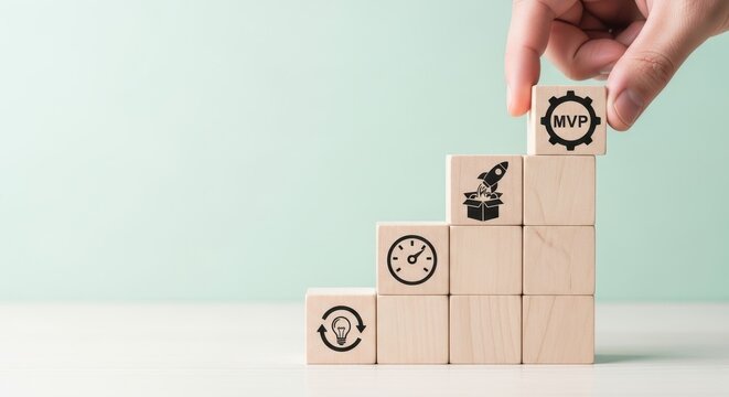 Hand placing MVP block on top of wooden step structure