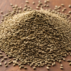 Obraz premium A pile of aromatic ajwain seeds showcasing its earthy tones and tiny textured surface