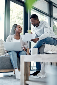 Smile, black couple and laptop with documents at house for finance, review budget and expenses. People, reading and paperwork for bank statement, insurance application and invoice on mortgage payment
