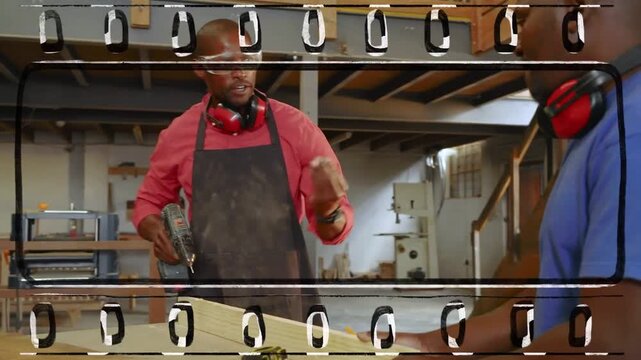 Lead starting drill on set panel in woodshop, guiding aide driving screws, assembling, film overlay