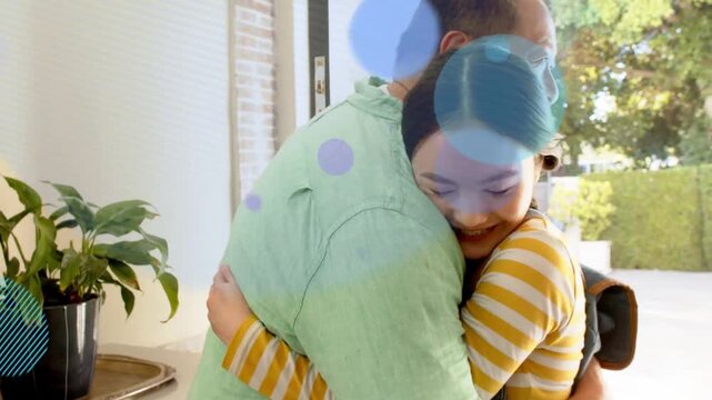 Father opening front door welcoming daughter, colorful bubbles appearing as they hug and enter home