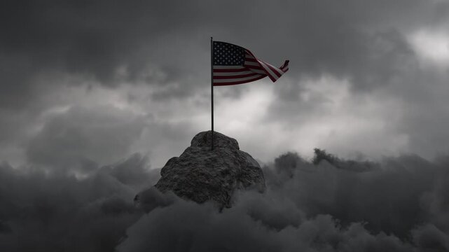 Waving US flag on rocky landscape covered by grey clouds