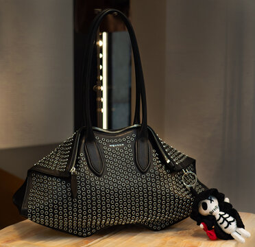 Alexander McQueen Manta shoulder bag in black leather with studs and charm. Milan, Italy, 7 March 2026