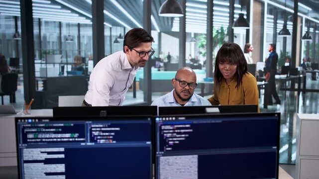 Team Developing Code On Desktop