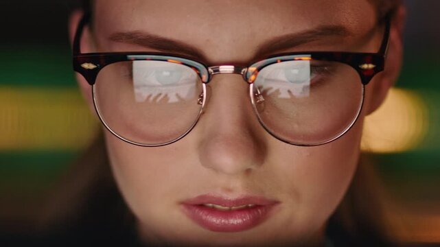 Business, glasses and woman typing on computer for information, reflection or data capturing at night. Face, reading specs and professional person with technology for report deadline in office
