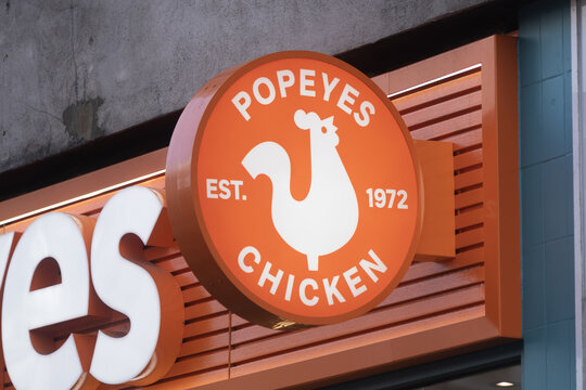 Popeyes Chicken restaurant sign on urban storefront