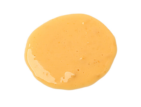 Orange dipping sauce spill top view