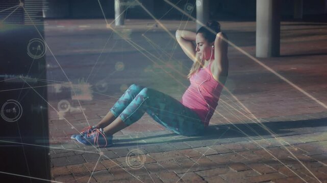Crunching woman in pink top, patterned leggings lifting torso on mat at urban plaza, HUD overlays