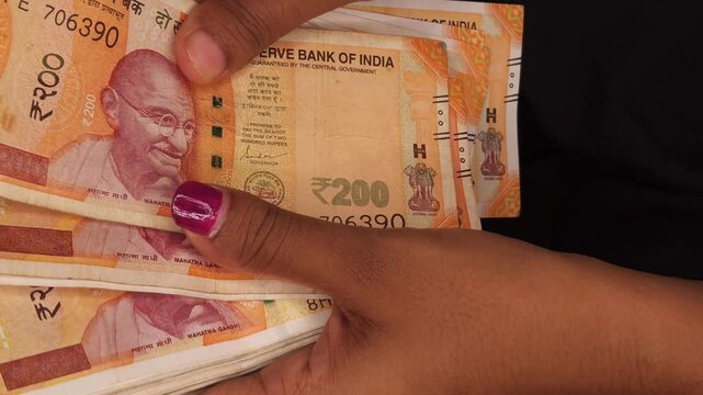 Counting Indian Rupee 200 Notes by Hand Cash Money Finance Concept India
