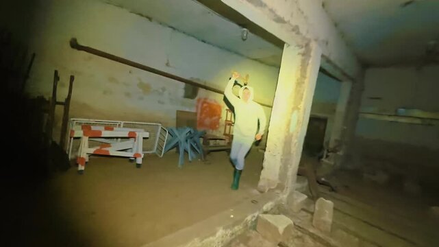 The guy runs away in the basement from a maniac with an axe, who threatens him with violence. An inadequate psycho is chasing a guy. Life-threatening. The survival instinct. From the first person.