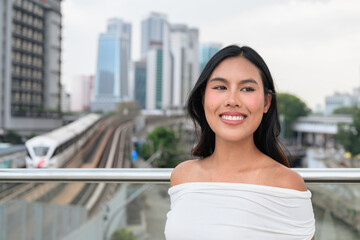 Fototapeta premium Asian Tourist Woman Portrait in Kuala Lumpur River of Life Urban City Background