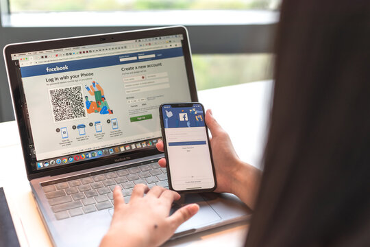 BANGKOK, THAILAND-February 26, 2019: Facebook social media Meta app icon signup page on  mobile phone smartphone device and computer laptop for user FB live public communication network.