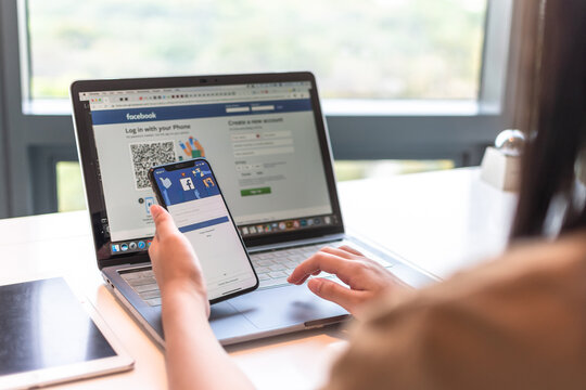 BANGKOK, THAILAND-February 26, 2019: Facebook social media Meta app icon signup page on  mobile phone smartphone device and computer laptop for user FB live public communication network.