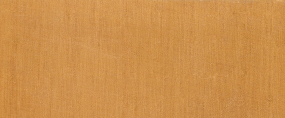 Fototapeta premium Close up of yellow ochre fabric texture background with detailed weave pattern for fashion design upholstery or textile industry projects